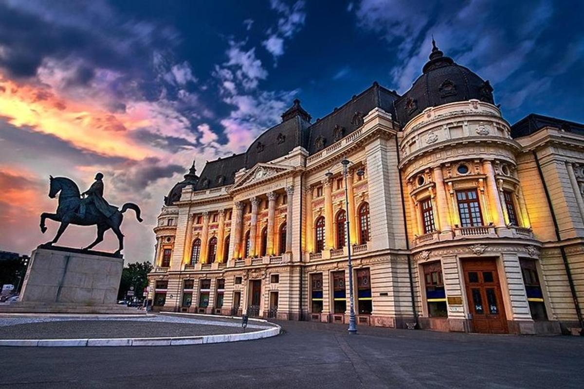 a large building with a statue in front of it