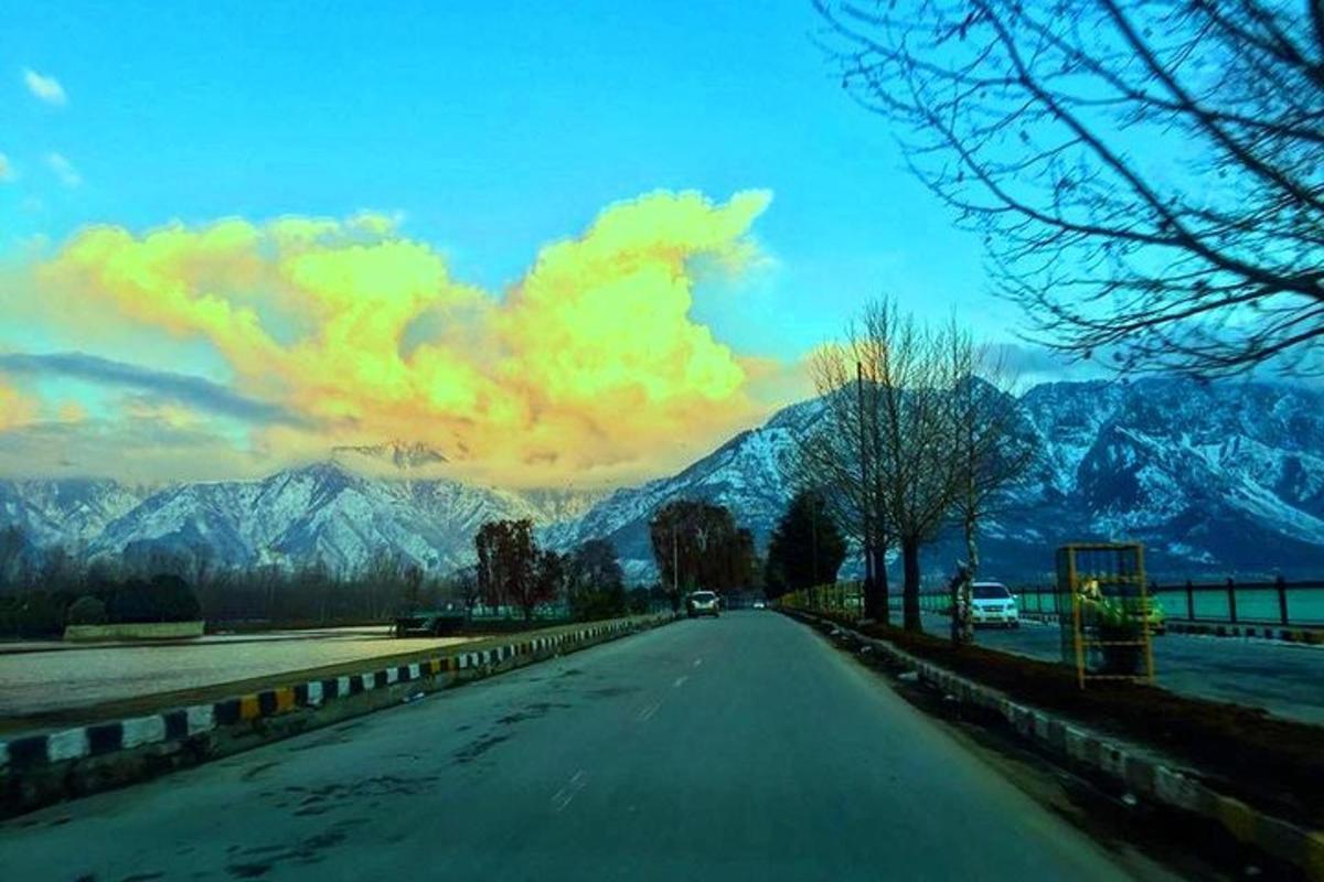 a view of a road with mountains in the distance