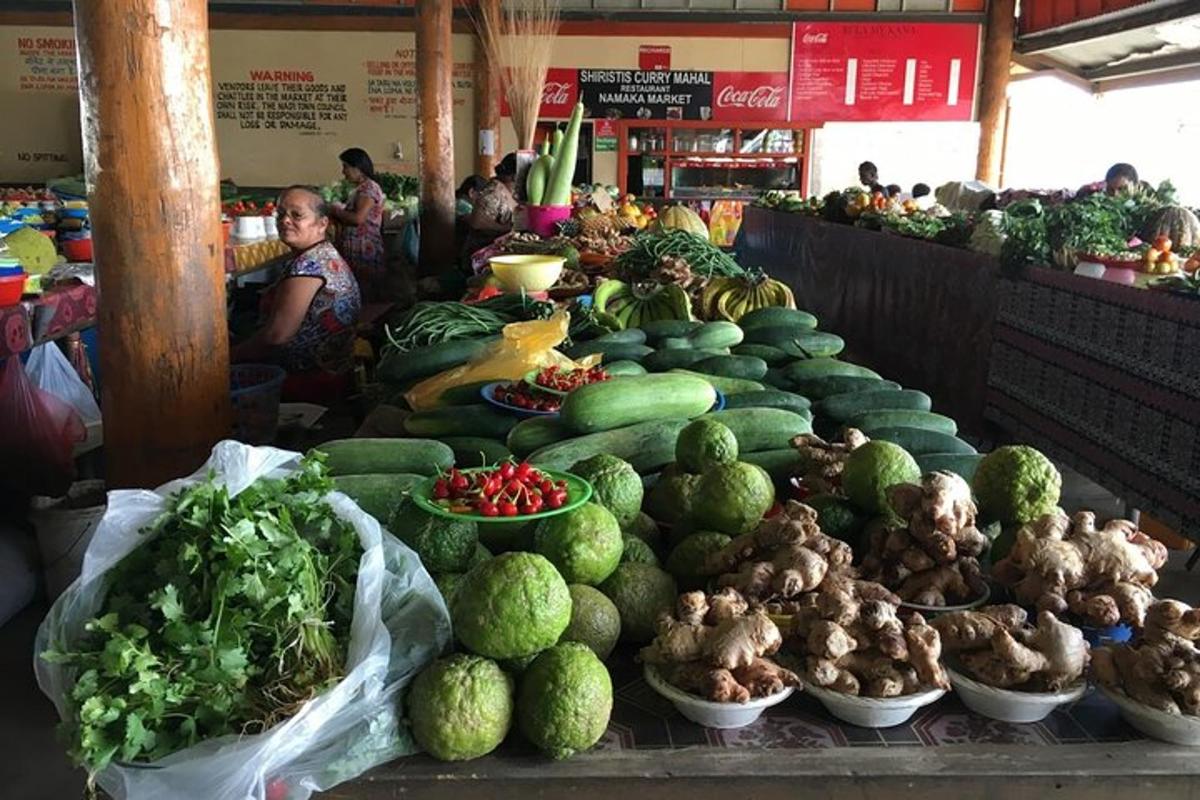 a market with many fruits and vegetables on display