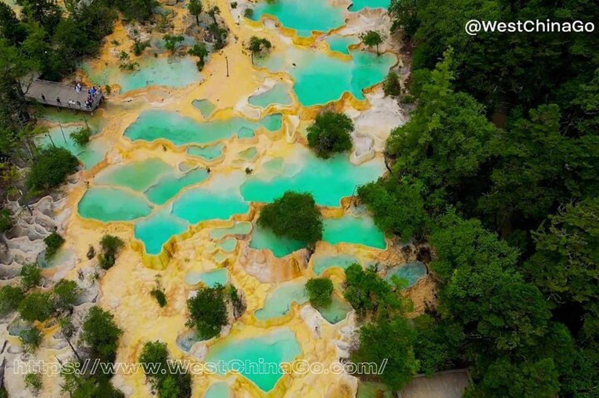 an aerial view of a pool of blue water