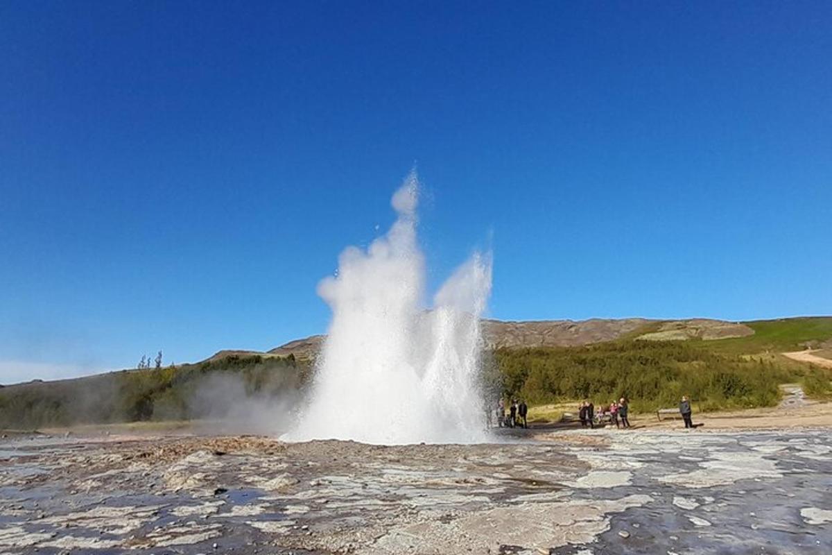 a geosphere of steam erupting from a geyser