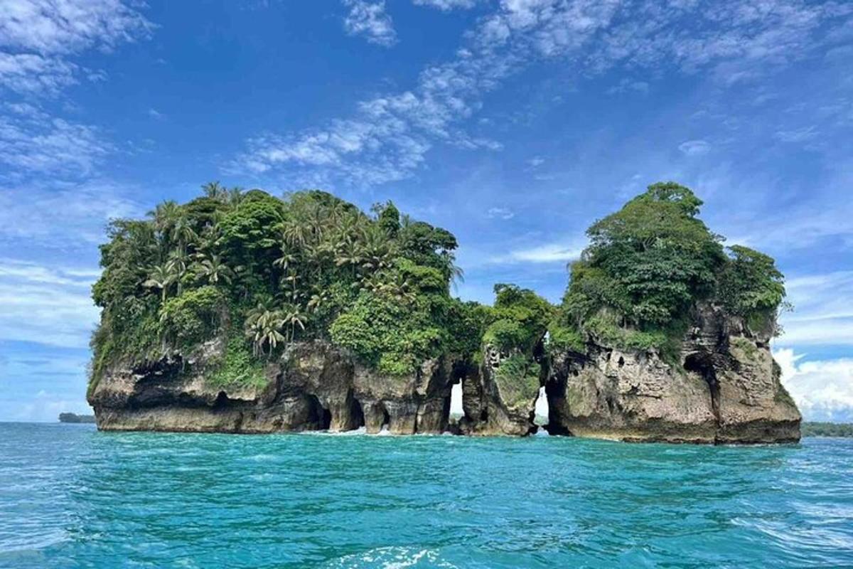 a small island in the ocean on a clear day