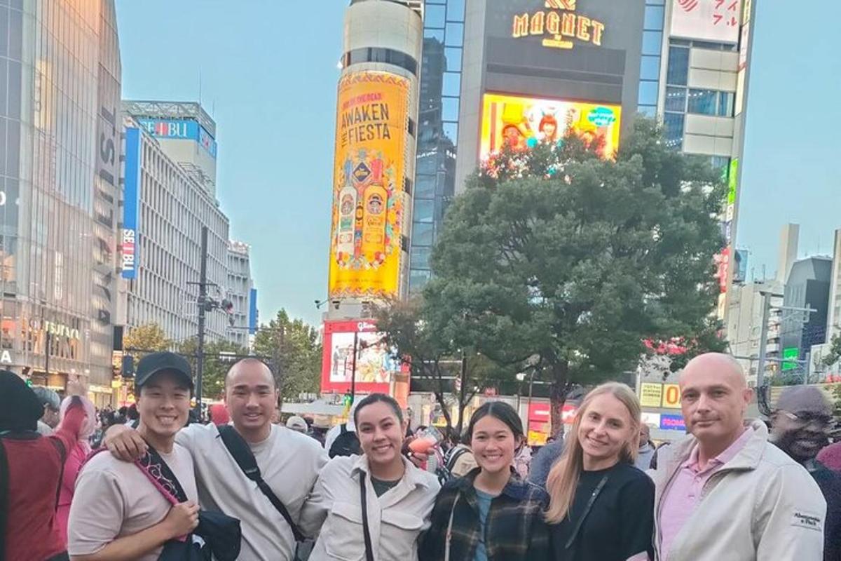a group of people posing for a picture in a city