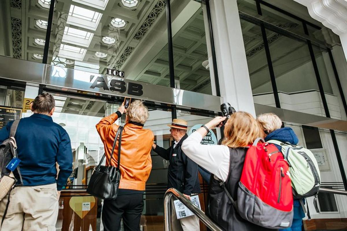 a group of people taking pictures of a man