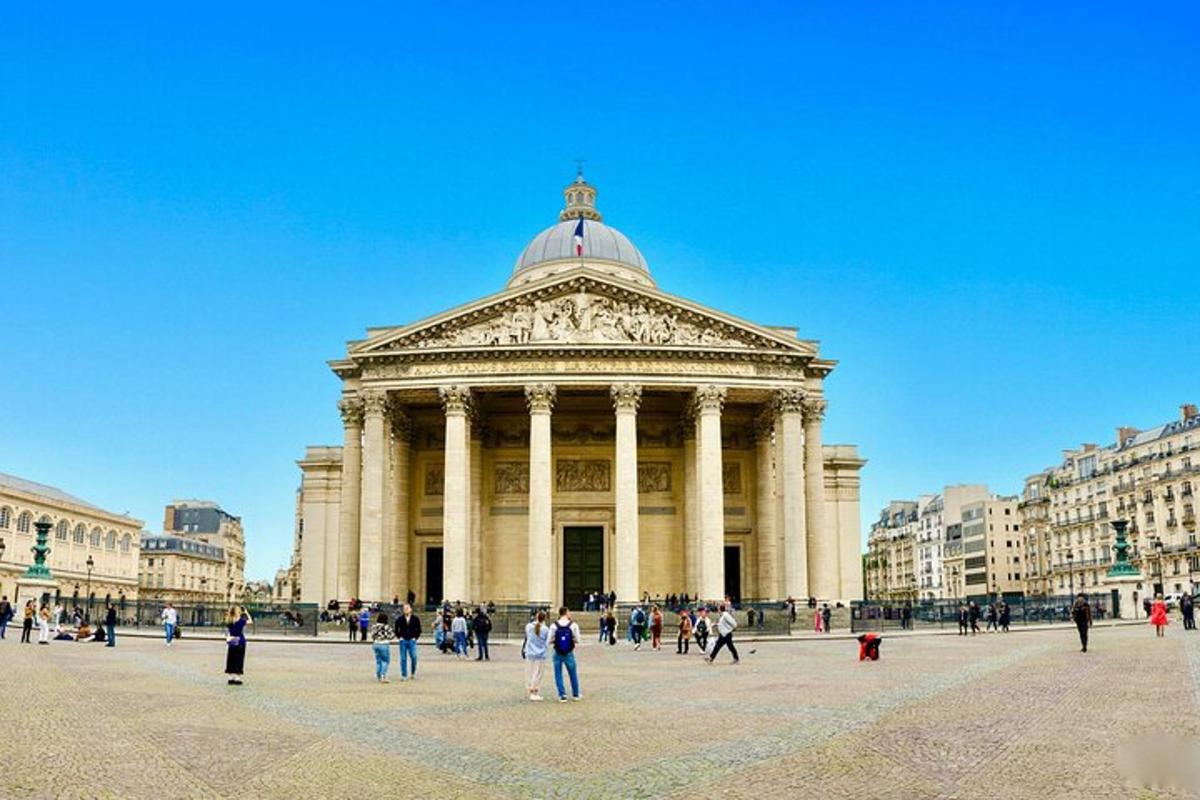 a group of people walking in front of a building