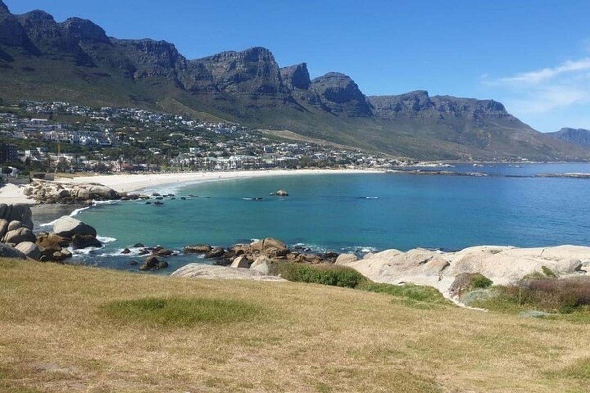 a view of a beach with mountains in the background