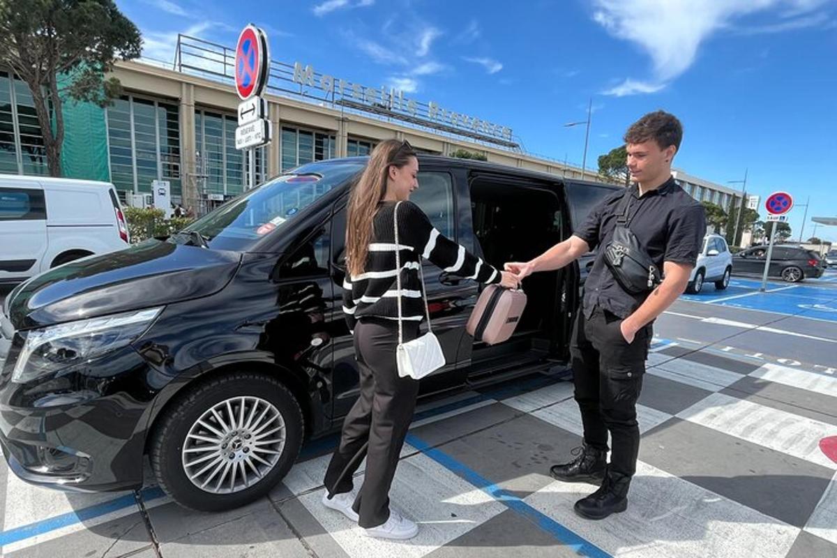 a man and a woman shaking hands next to a car