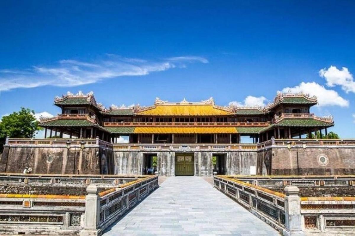 a large building with a bridge in front of it