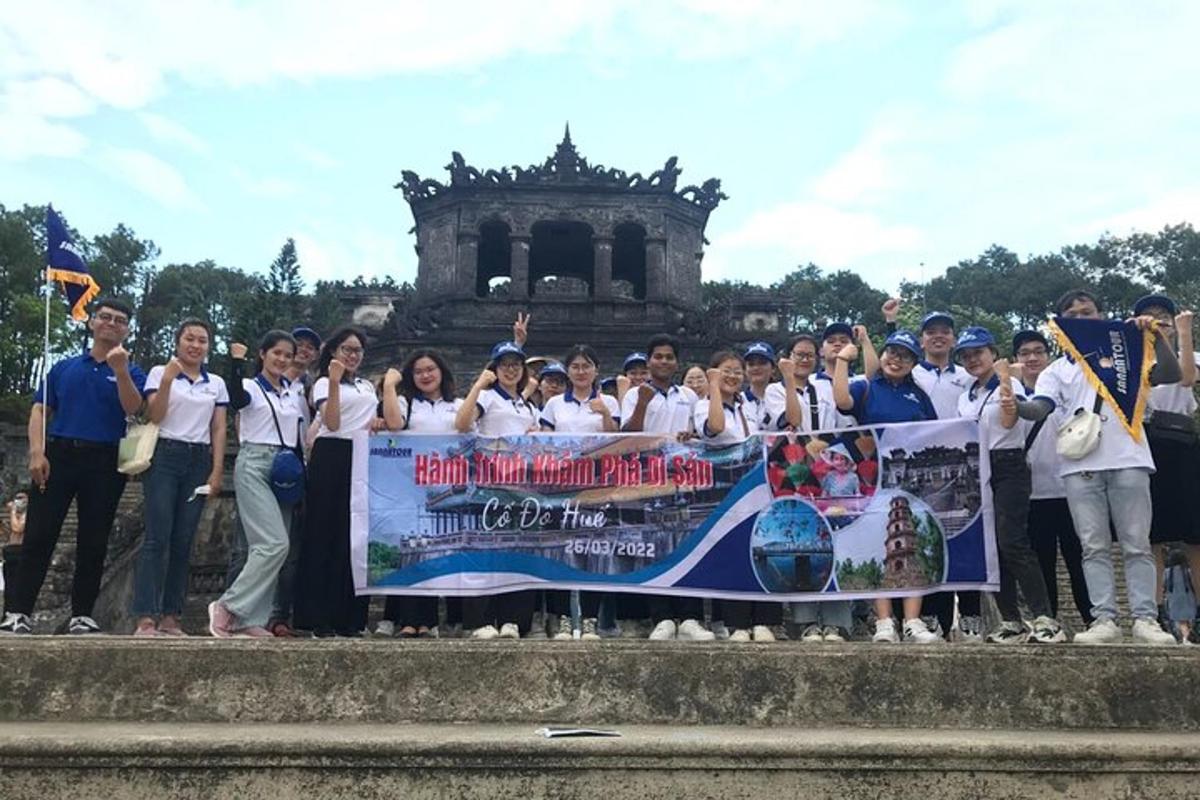 a group of people holding a banner in front of a building