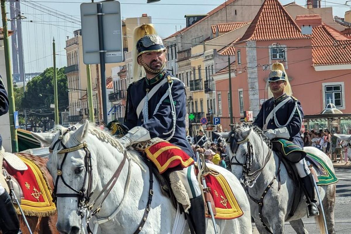 two men in uniform riding horses down a street