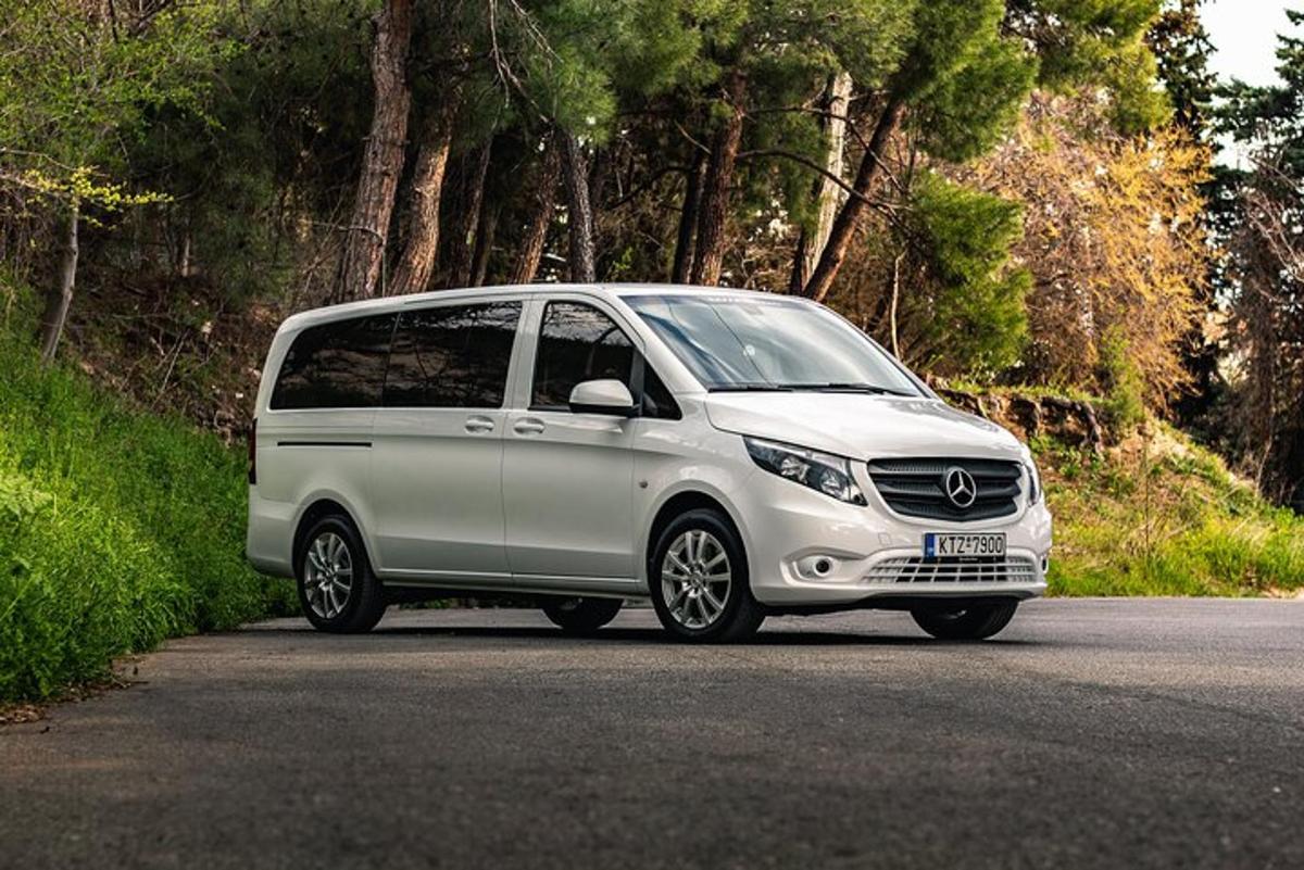 a silver van parked on the side of a road