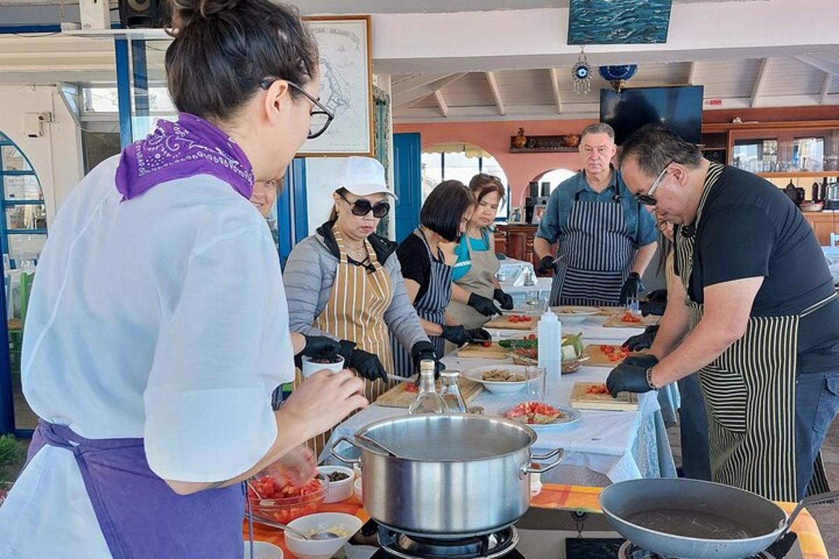 a group of people preparing food in a kitchen