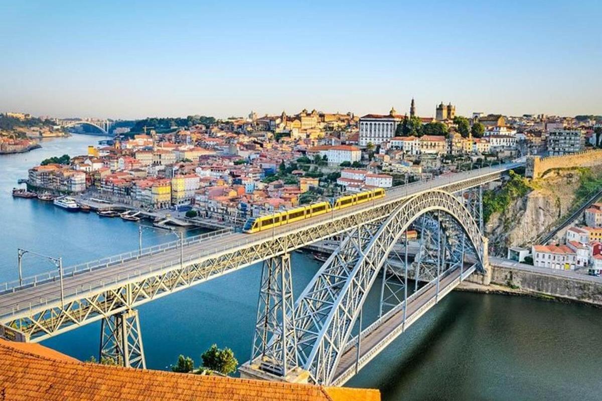 a train on a bridge over a river
