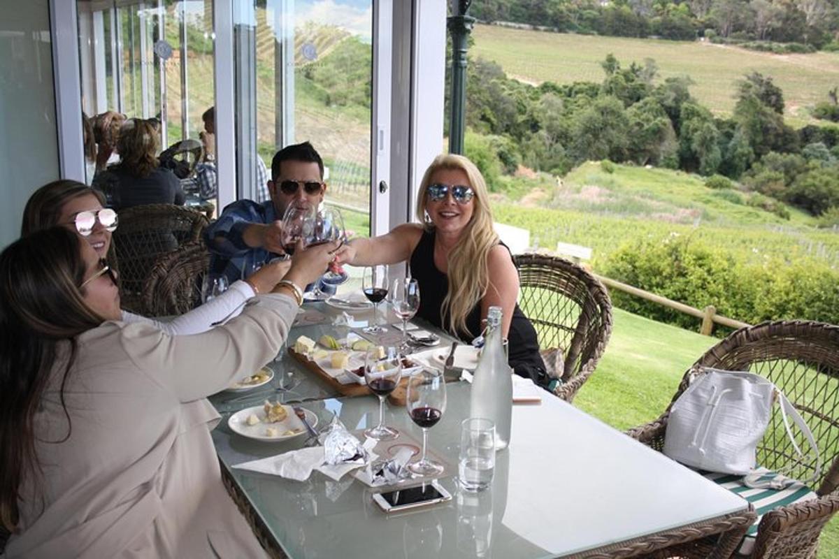 a group of people sitting at a table with wine glasses