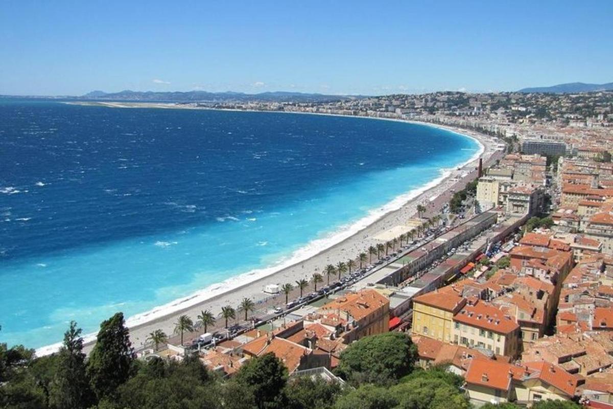 a view of a beach with buildings and the ocean
