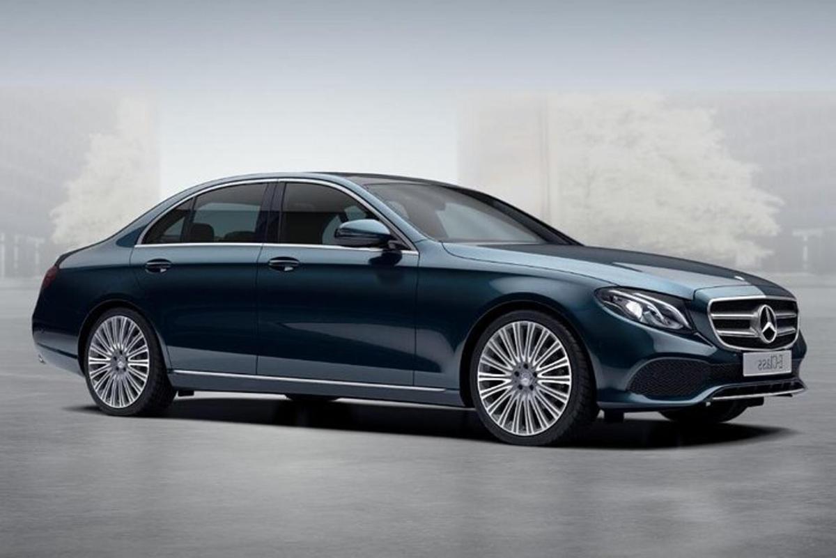 a blue mercedes benz car parked in a building