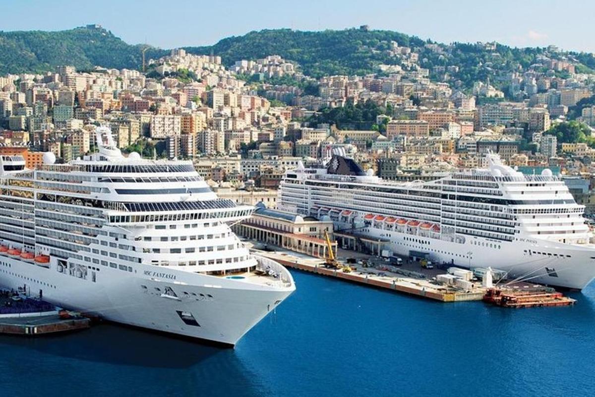 two cruise ships are docked in a harbor