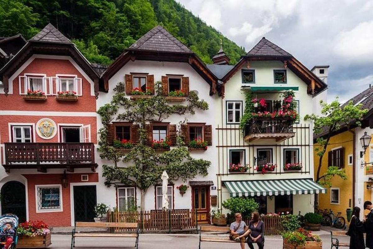 a building with flower boxes on the windows in a town