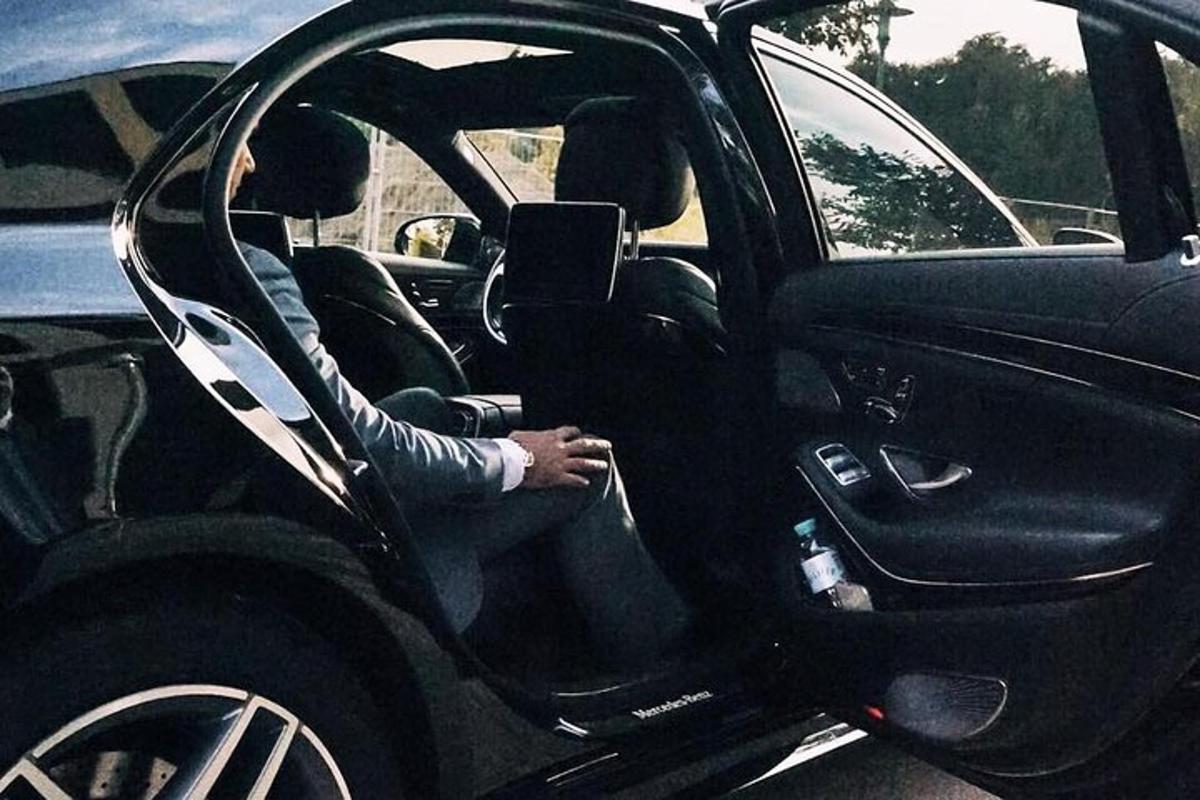 a person sitting in the drivers seat of a car