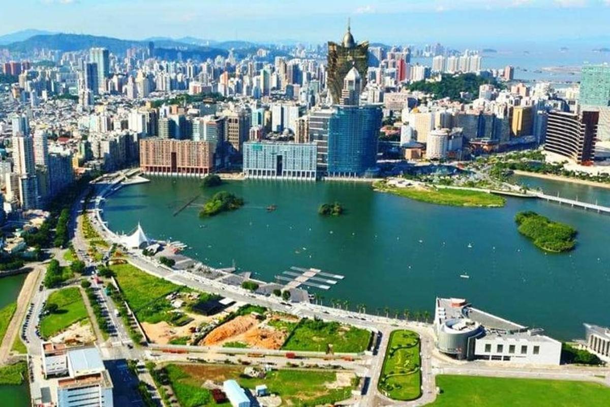 an aerial view of a city with a body of water