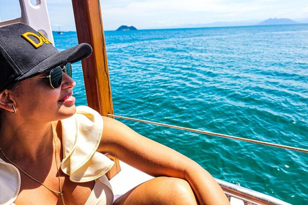 a woman sitting on a boat in the water