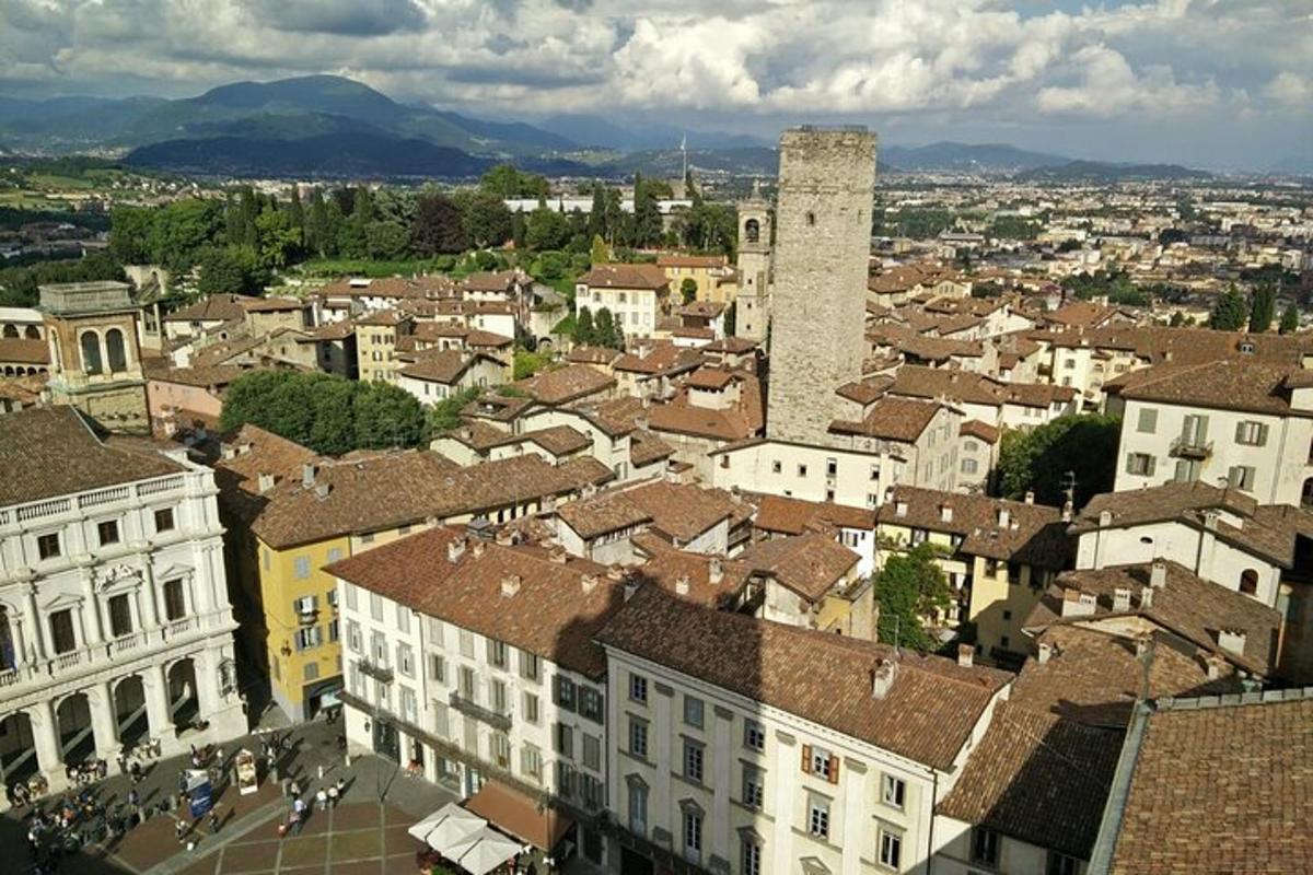 an aerial view of a city with buildings and a tower
