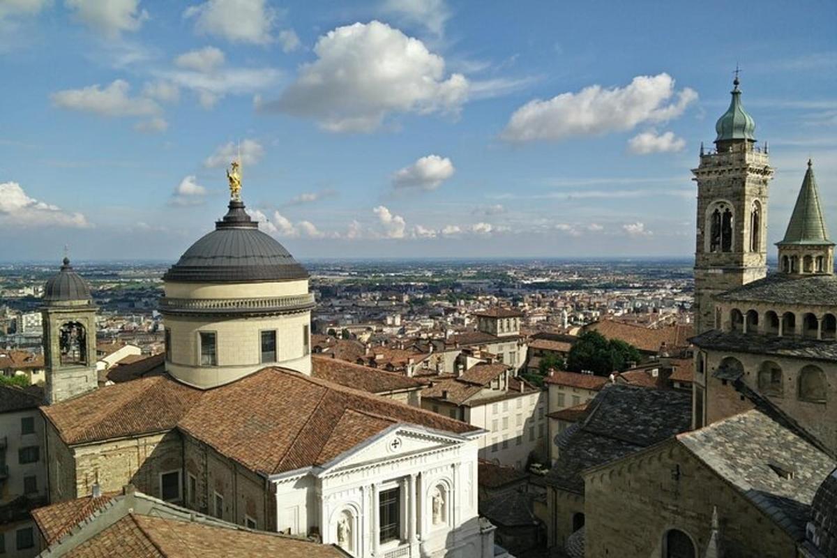 an aerial view of a city with buildings and a church