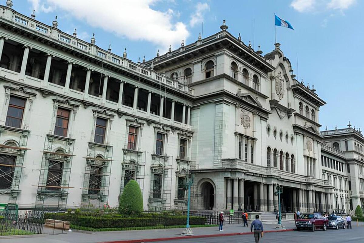 a large white building with a flag on top of it