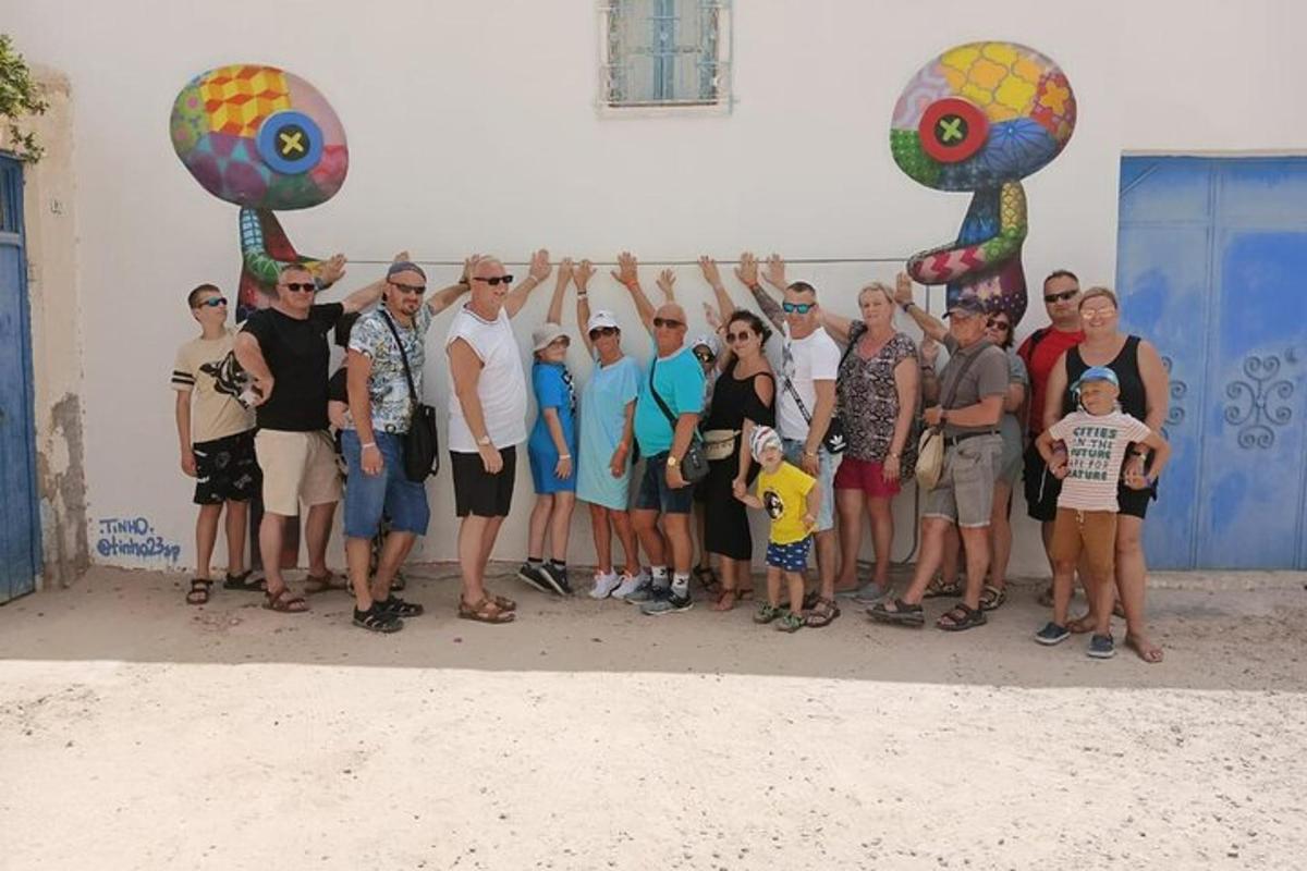 a group of people standing in front of a wall