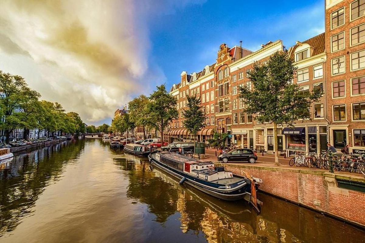 a river with boats docked next to some buildings