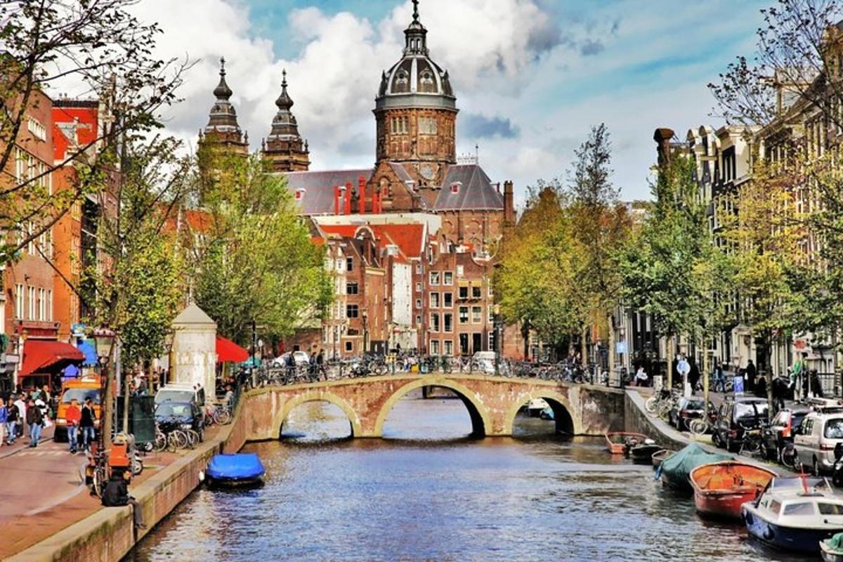 a bridge over a river in a city with buildings