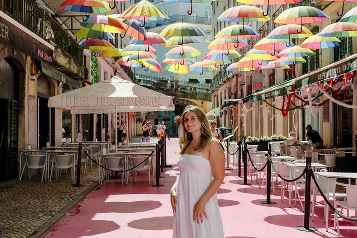 a woman in a white dress standing under umbrellas
