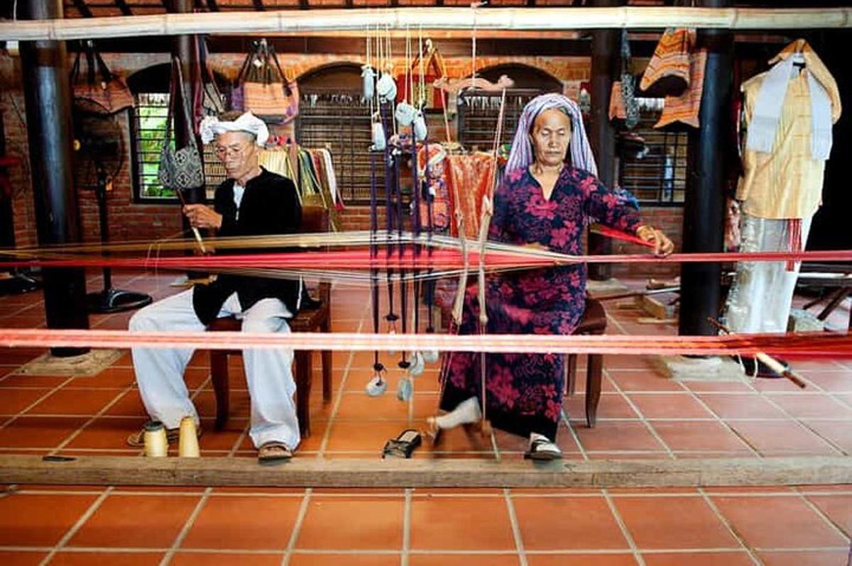 a man and a woman standing behind a net