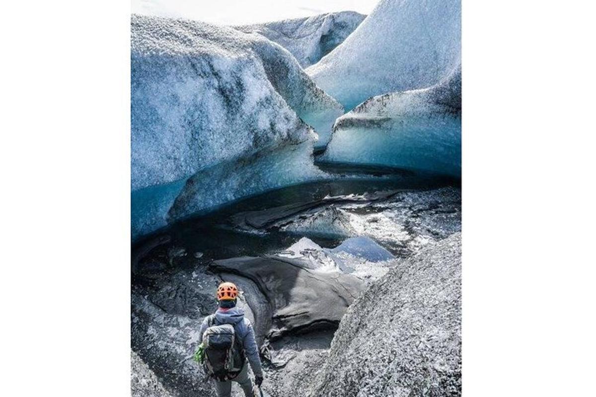 a person is walking on a glacier