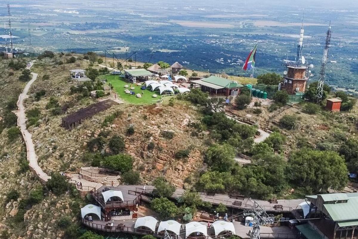 an aerial view of a village on top of a hill