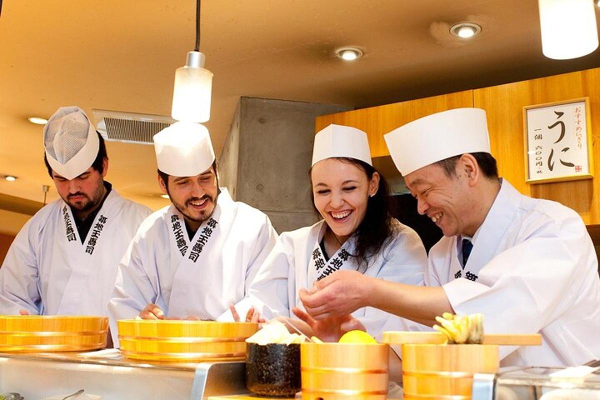 a group of chefs in a kitchen preparing food
