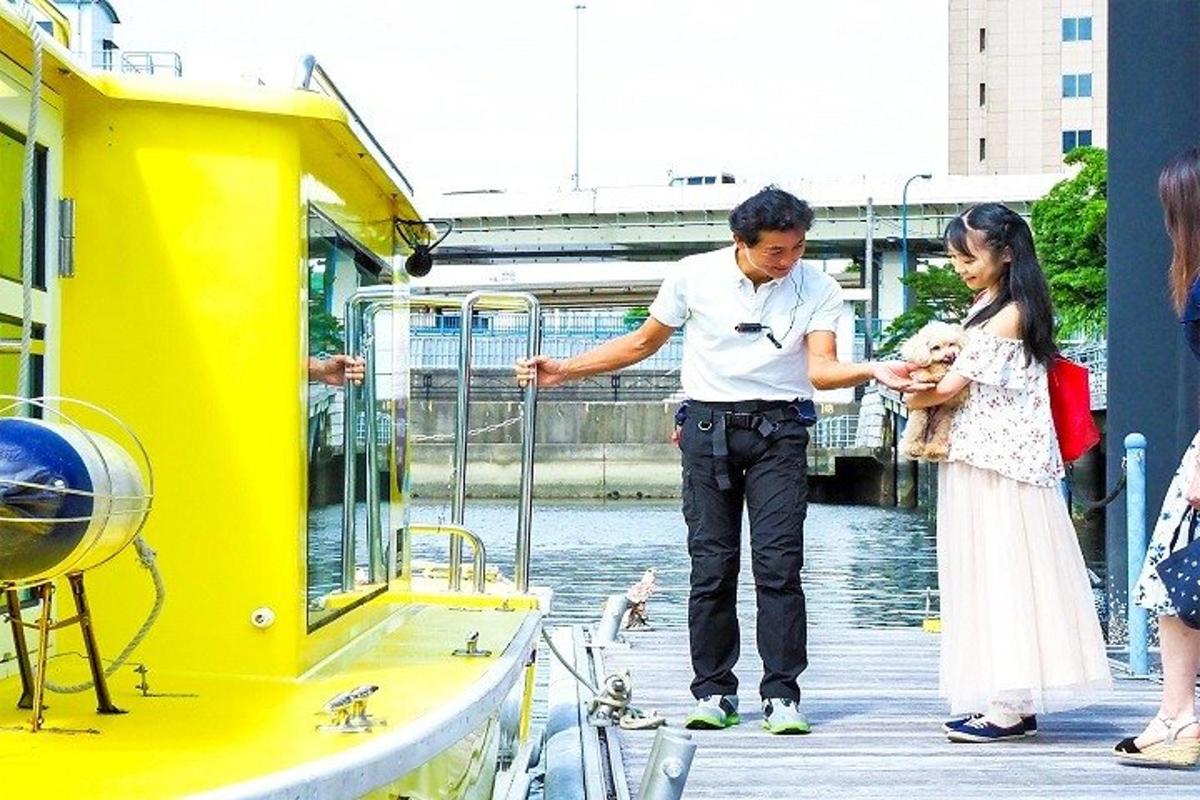 a man and a woman standing on a boat