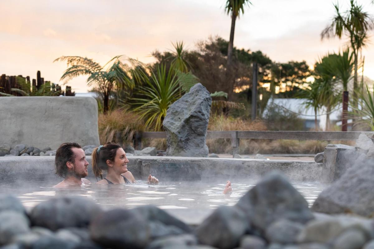 a man and a woman in a hot tub
