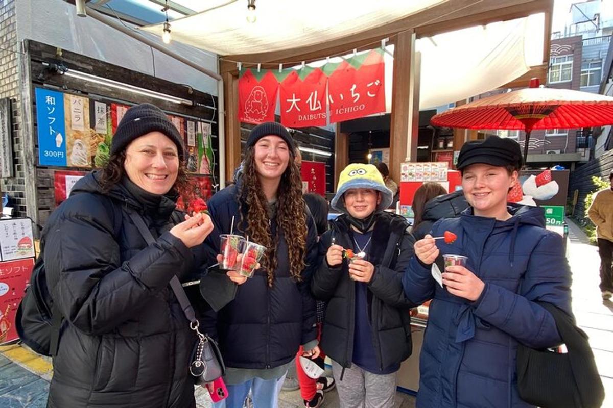 a group of people holding drinks in front of a store