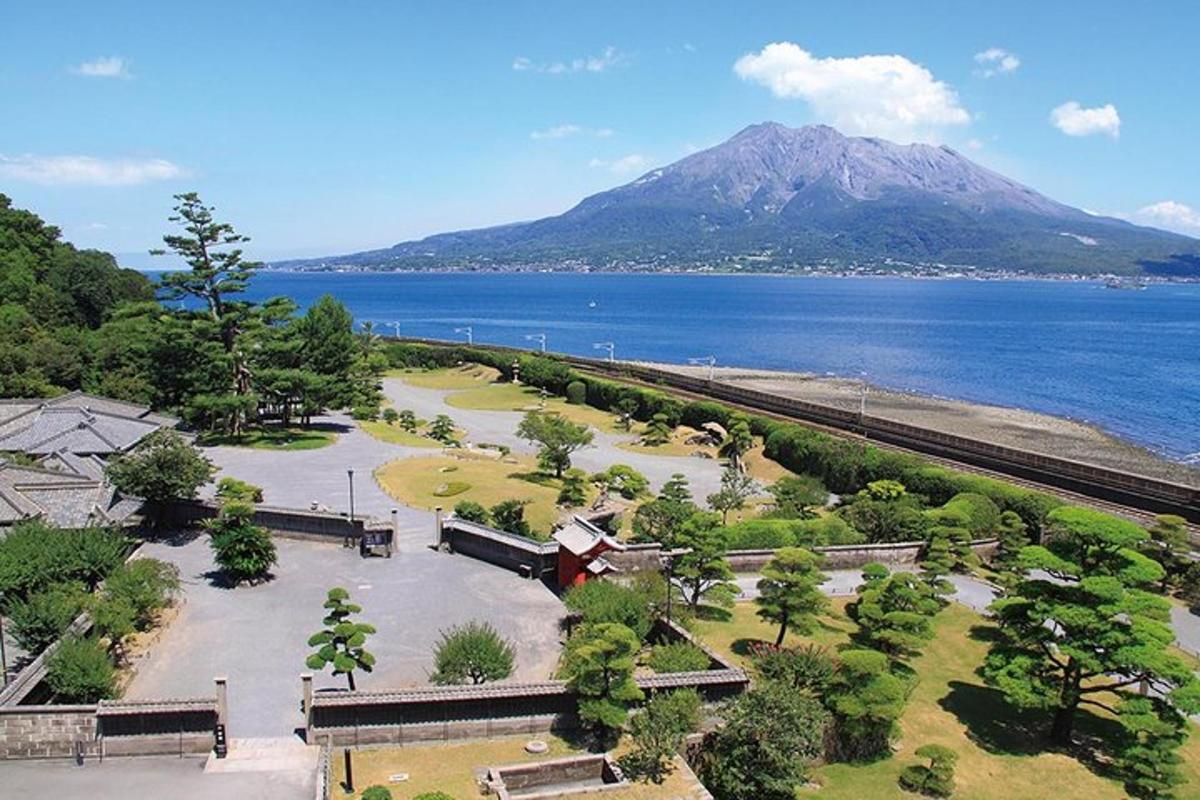 a park next to the water with a mountain