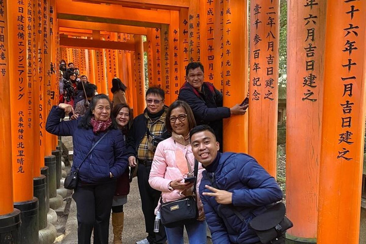 a group of people walking between orange columns