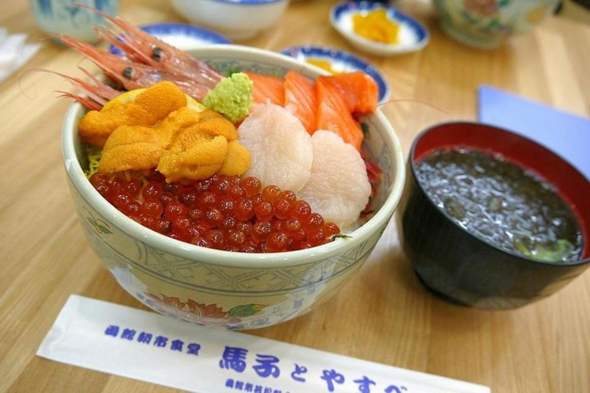 a bowl of fruit and vegetables on a table