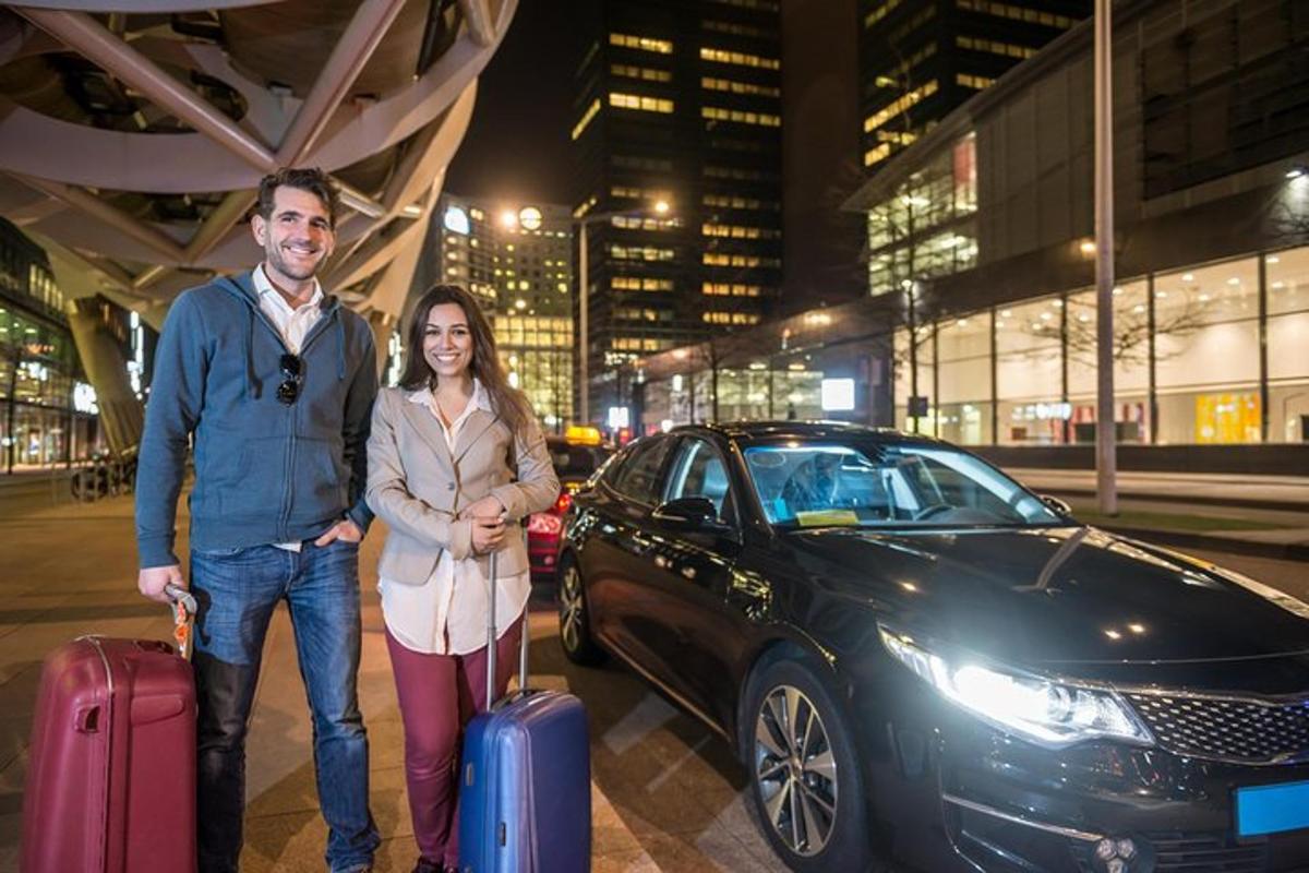 a man and woman standing next to a car with luggage