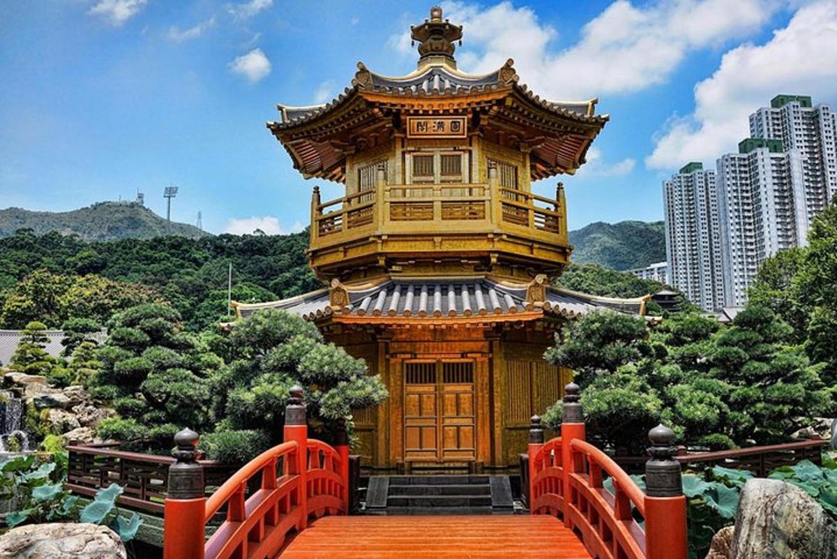 a large wooden building with a orange bridge