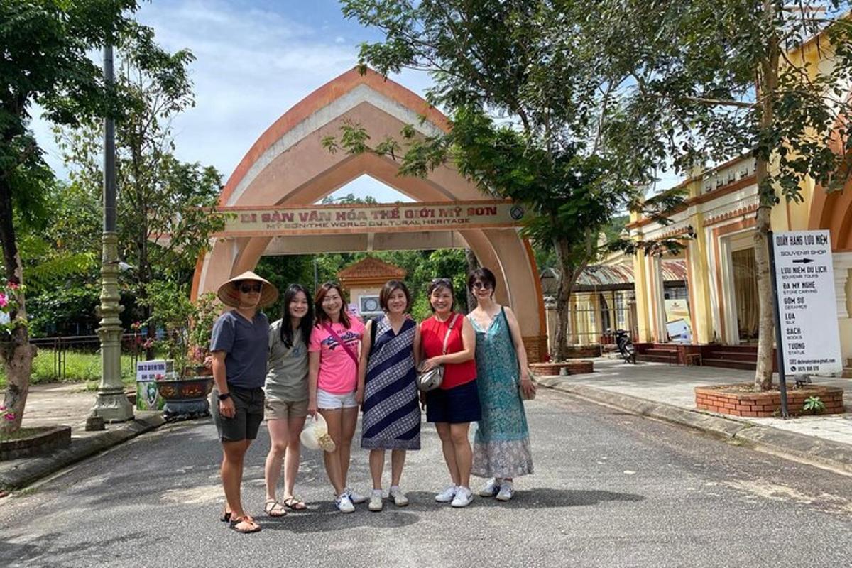 a group of people standing in front of a gate