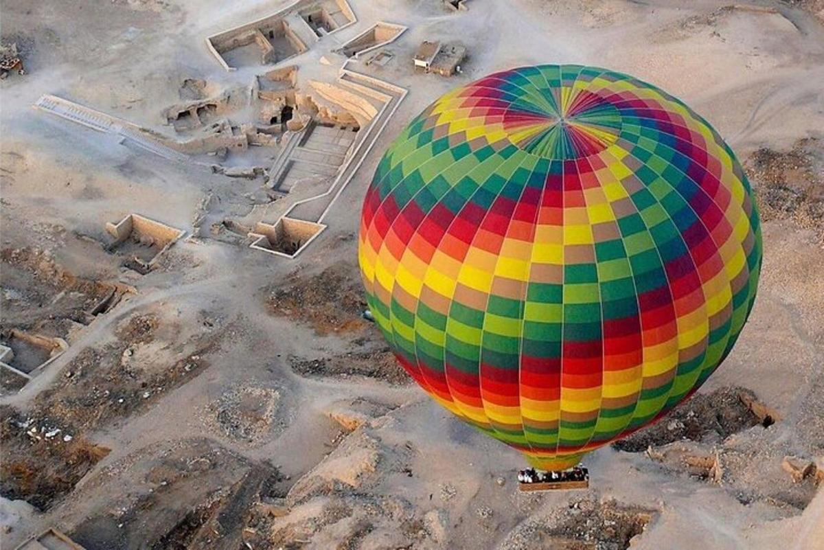 a colorful hot air balloon sitting on the ground