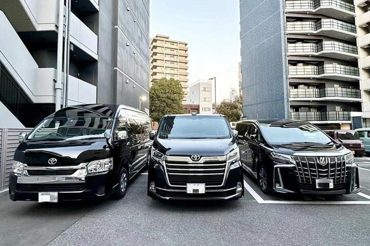 two luxury cars parked in a parking lot