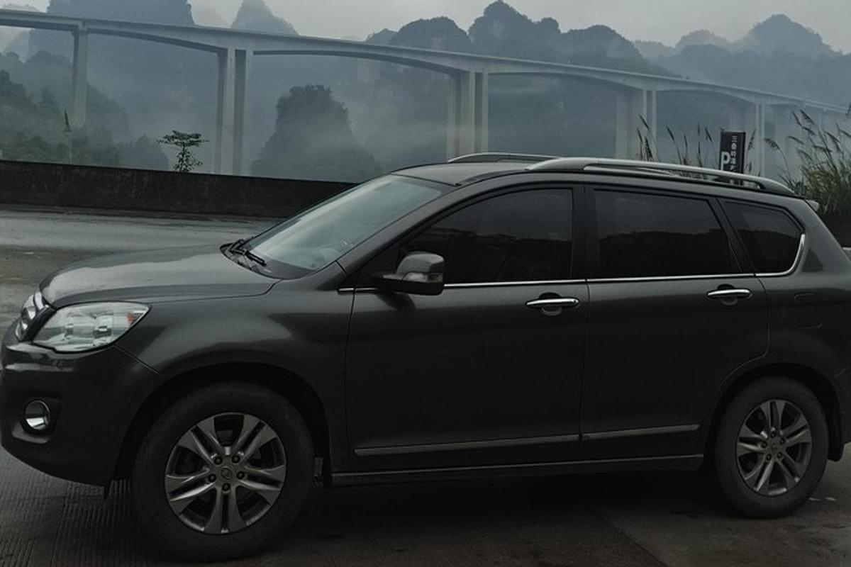 a black suv parked in a parking lot