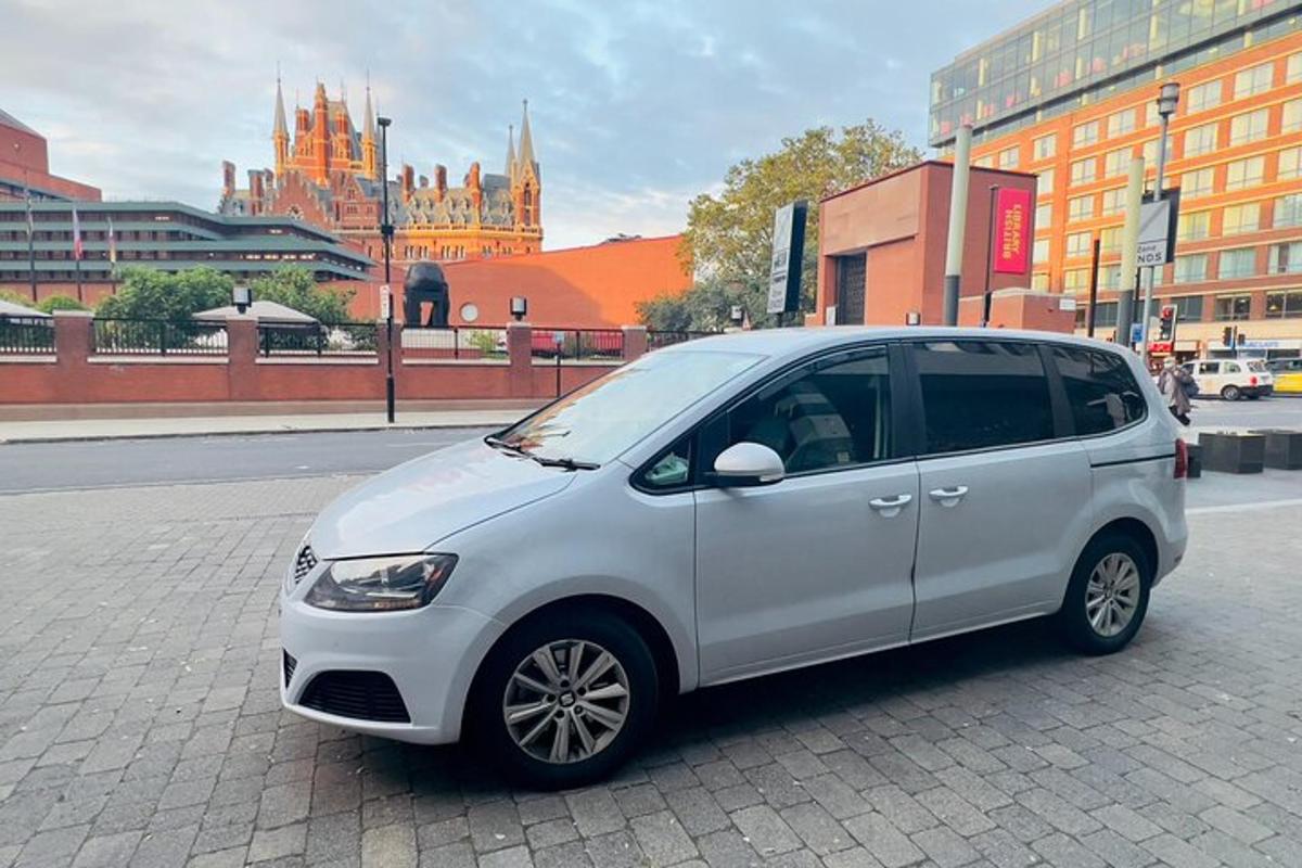 a white car parked on a street in a city
