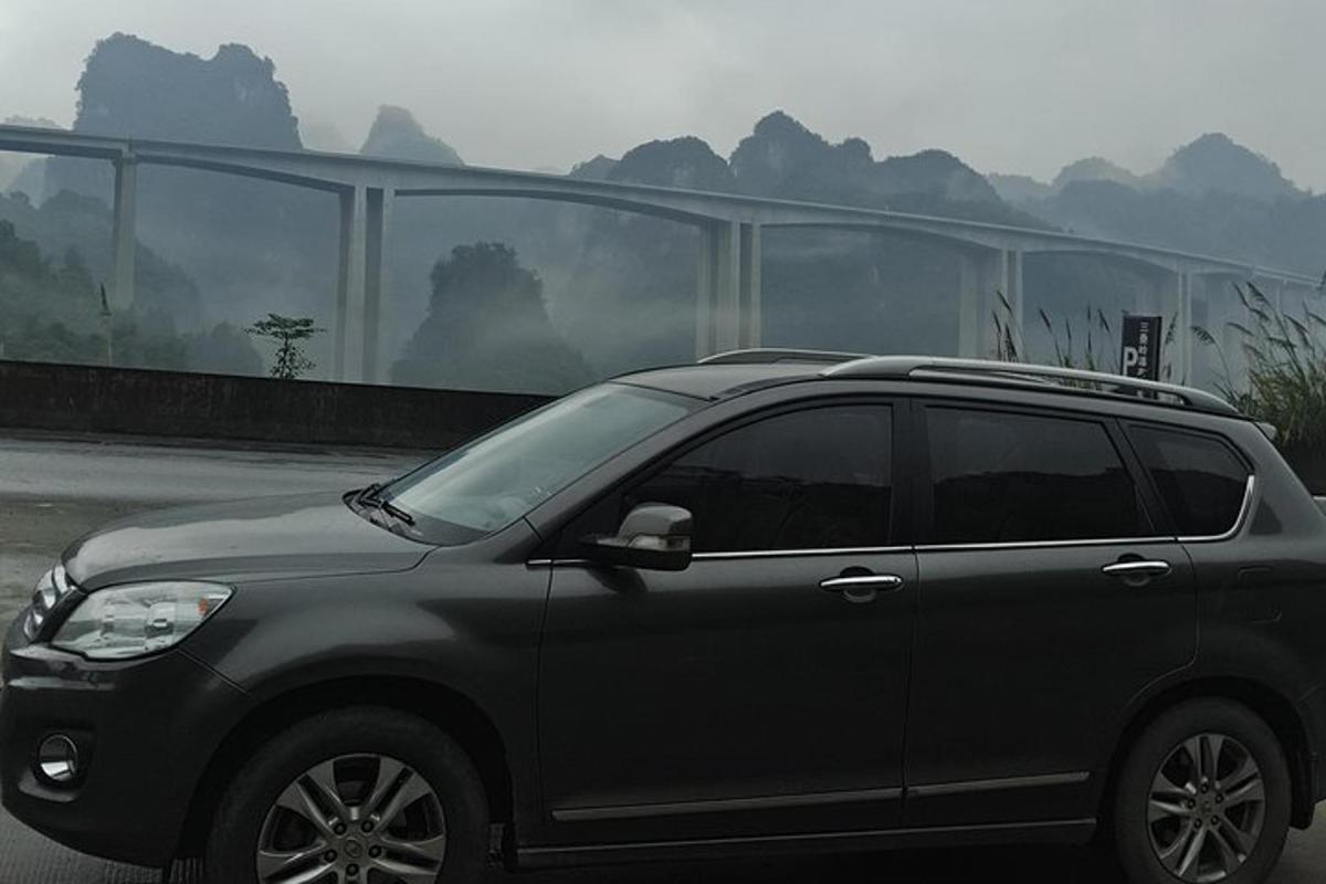 a gray suv parked in front of a building
